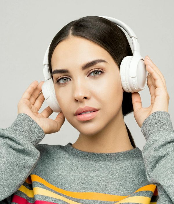 Young woman looking calmly into distance with clear focused eyes